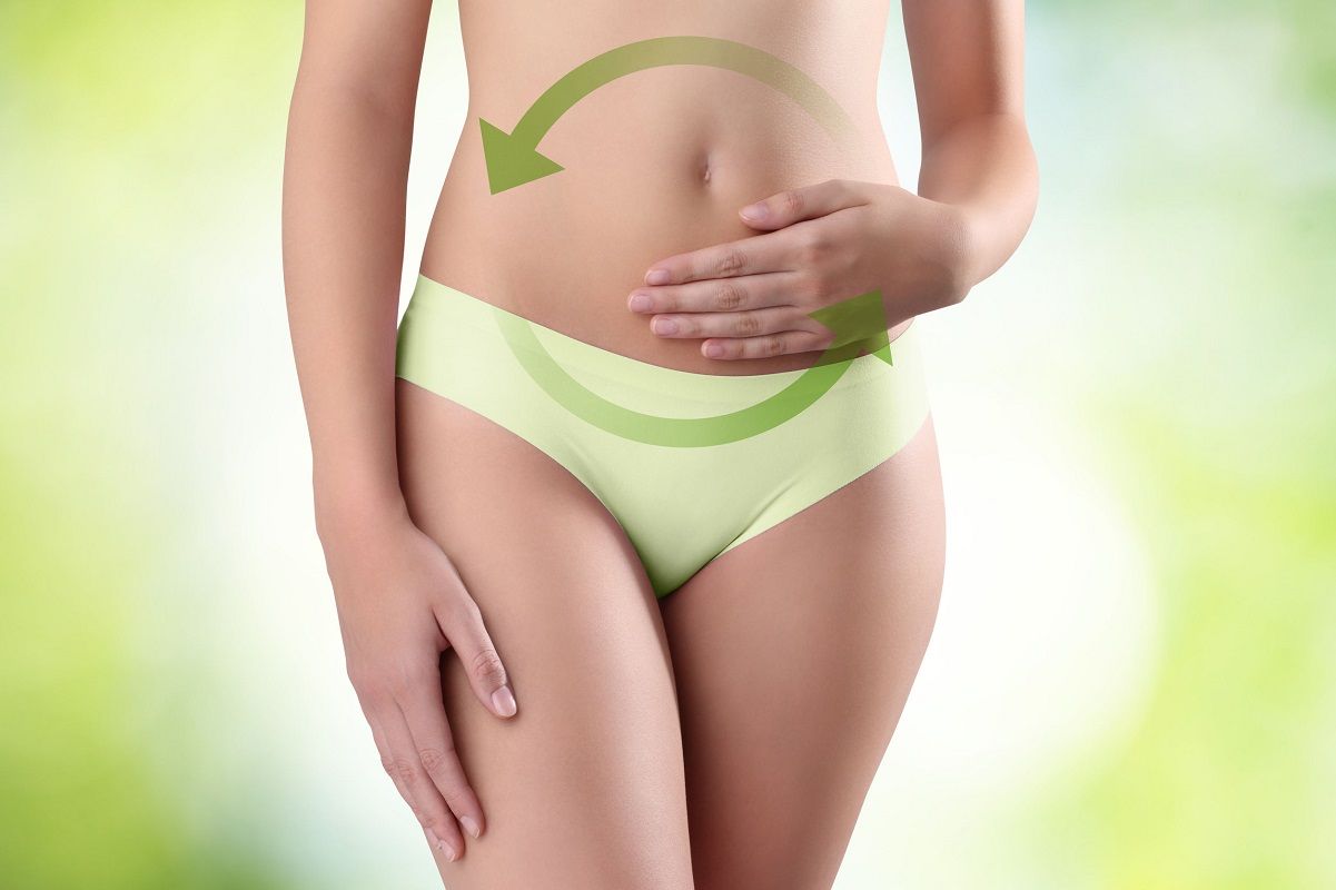 29986430 – woman hands on belly with green arrow