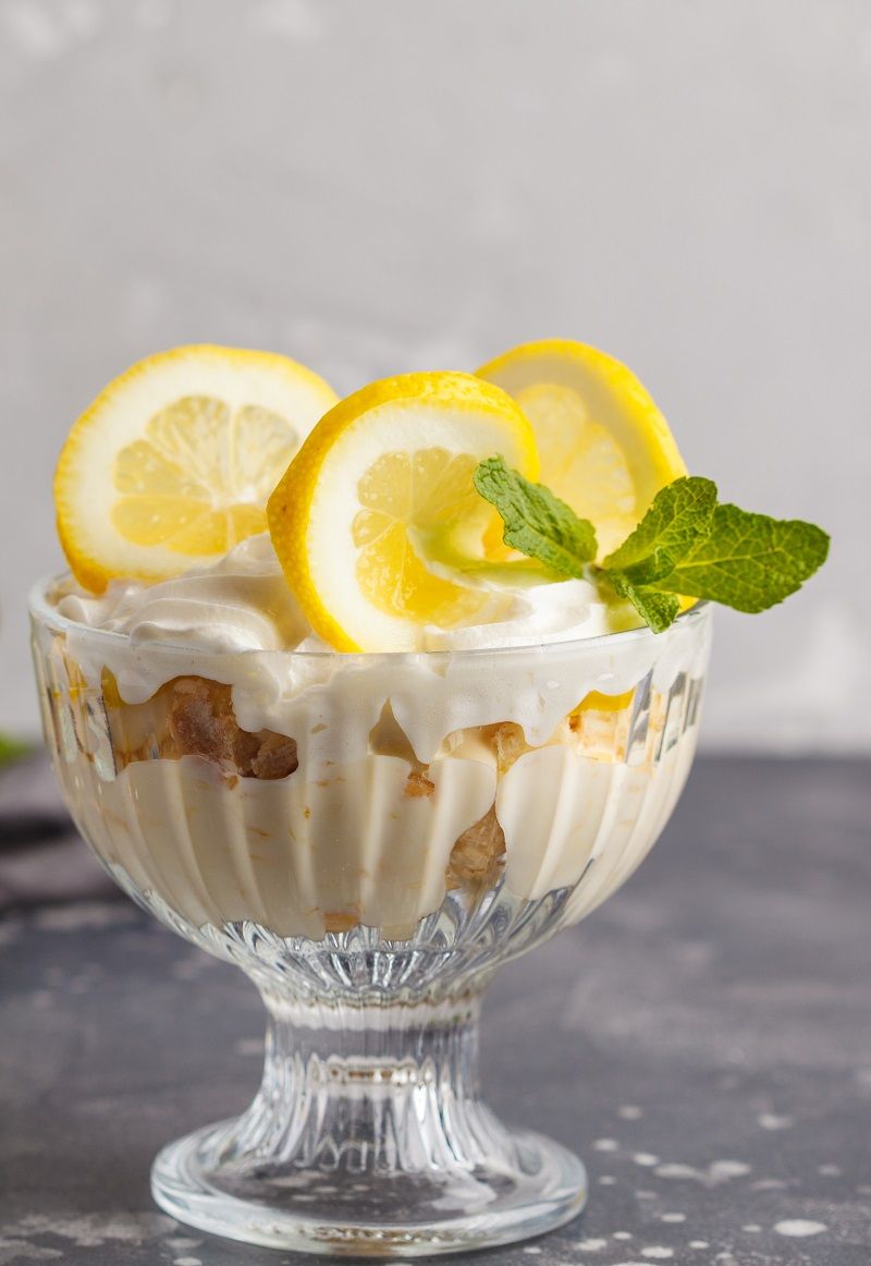 Lemon dessert. English lemon trifle, cheesecake, whipped cream,
