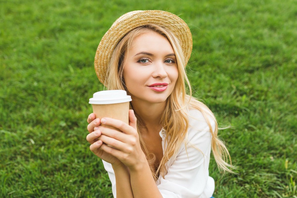 woman with coffee to go