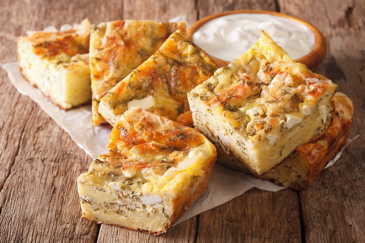 Traditional Serbian Gibanica with cheese, eggs and greens close-
