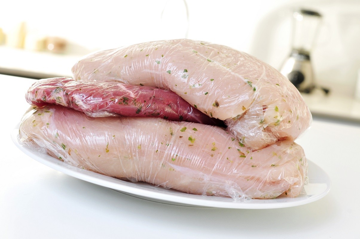 raw meat wrapped in plastic