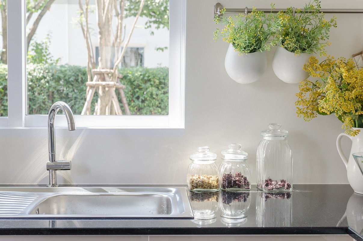 modern sink on black kitchen counter