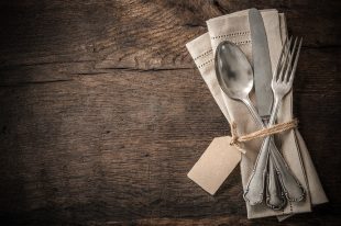 Vintage silverware with an empty tag
