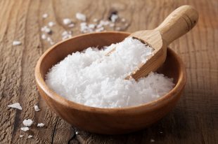 sea salt in wooden bowl and scoop