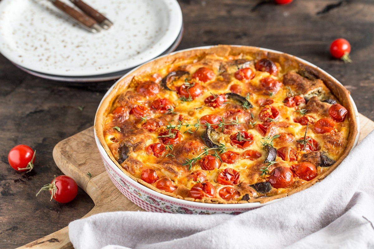 Vegetarian homemade pie, Quiche with cherry tomatoes, eggplant a