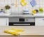 Wooden table with yellow napkin on kitchen background