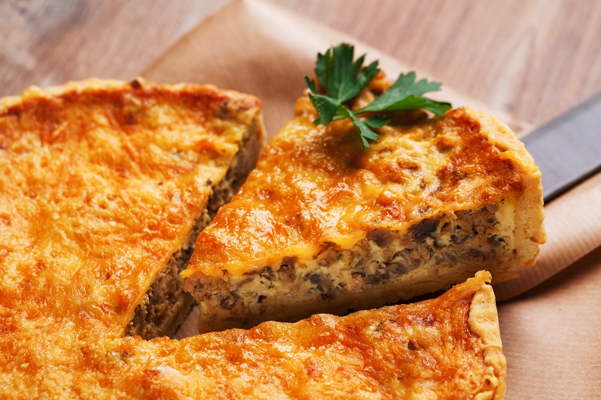 Traditional,Vegetable,Pie,On,Rustic,Wooden,Table.,Sliced,Slice,Of