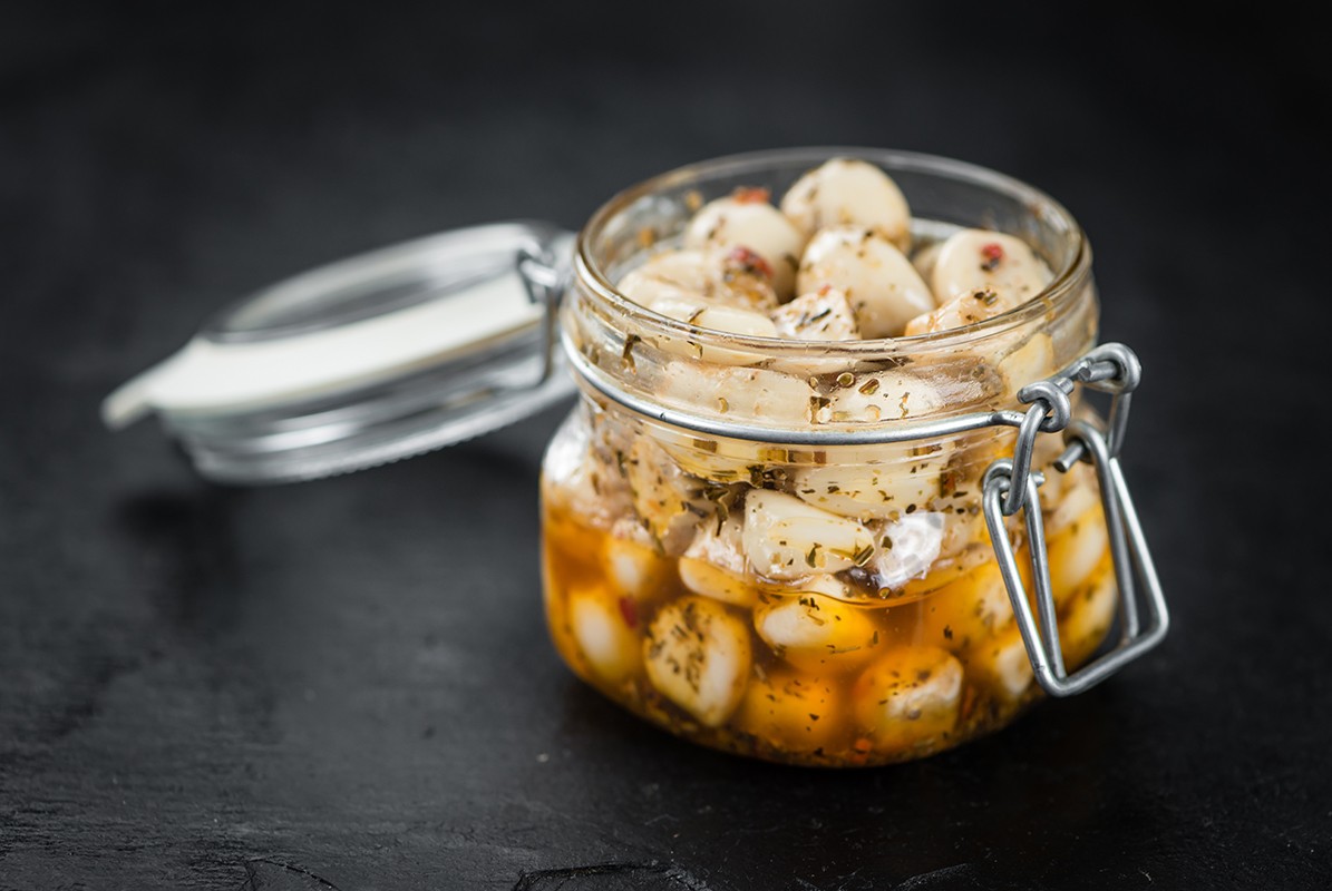 Some Marinated Garlic on a dark slate slab