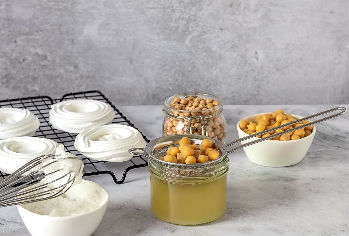 Vegan cooking concept. Meringue from canned chickpea water aquafaba. Healthy product. Eggs replacement and substitute.