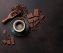 Coffee cup and chocolate on old kitchen table