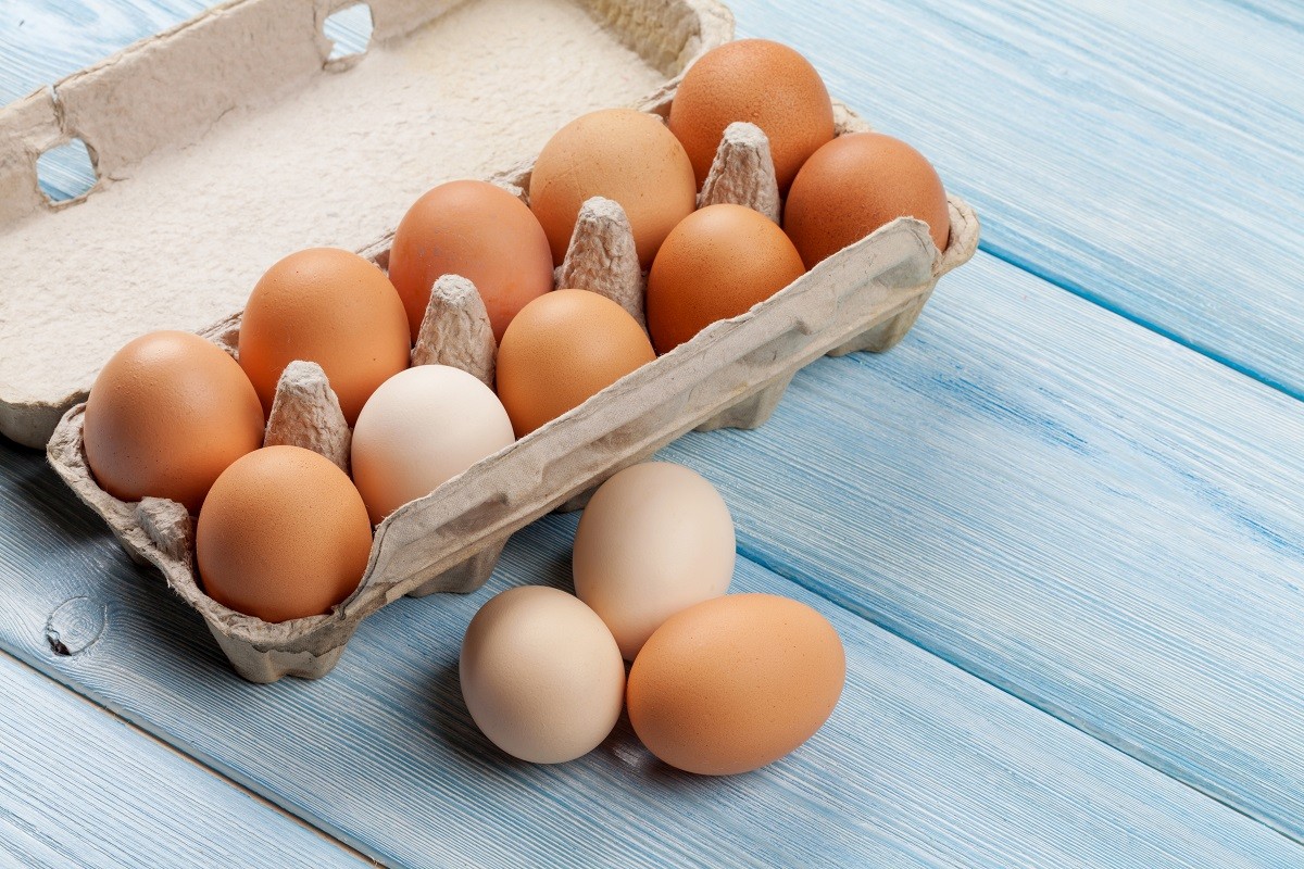 Cardboard egg box on wooden table