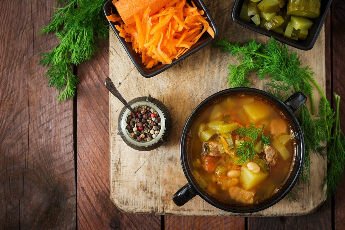 Soup with pickled cucumbers and beans in Ukrainian style. Top view