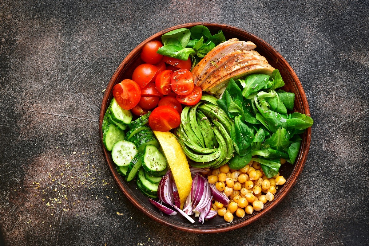 Lunch bowl with vegetables,beans and chicken meat.Top view.