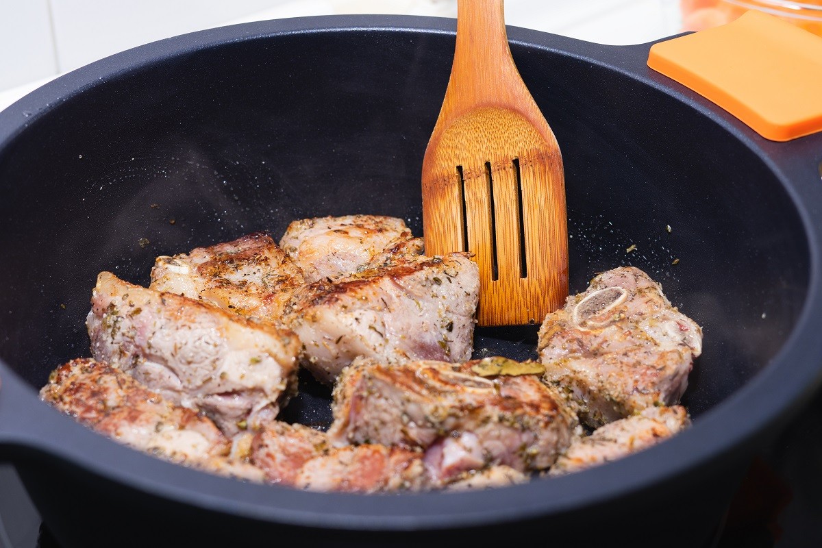 Process of sealing meat in a pot. Cooking concept.