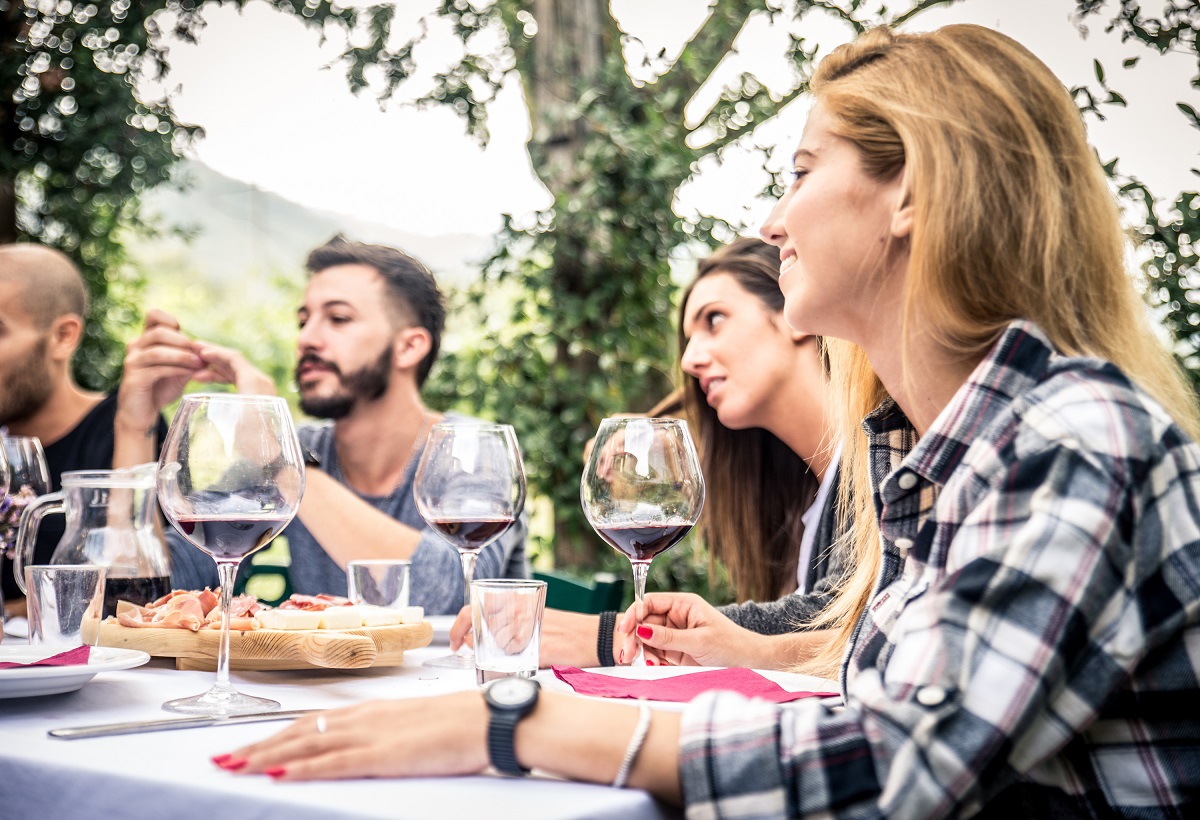 Friends having dinner in garden