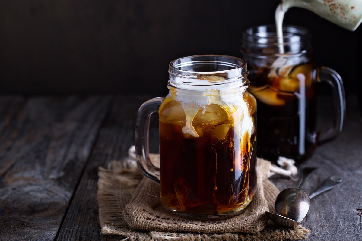 Iced coffee with milk in mason jars