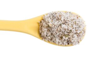 top view ceramic spoon with seasoned salt close up