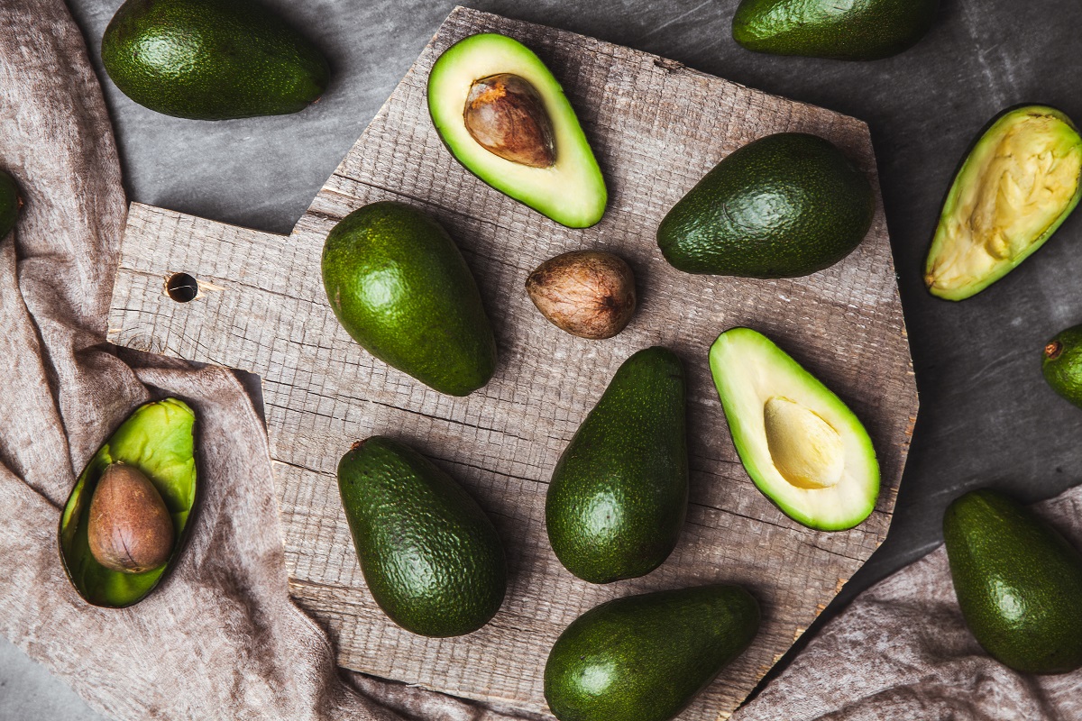 Avocado. Healthy food on the table. Rustic board.