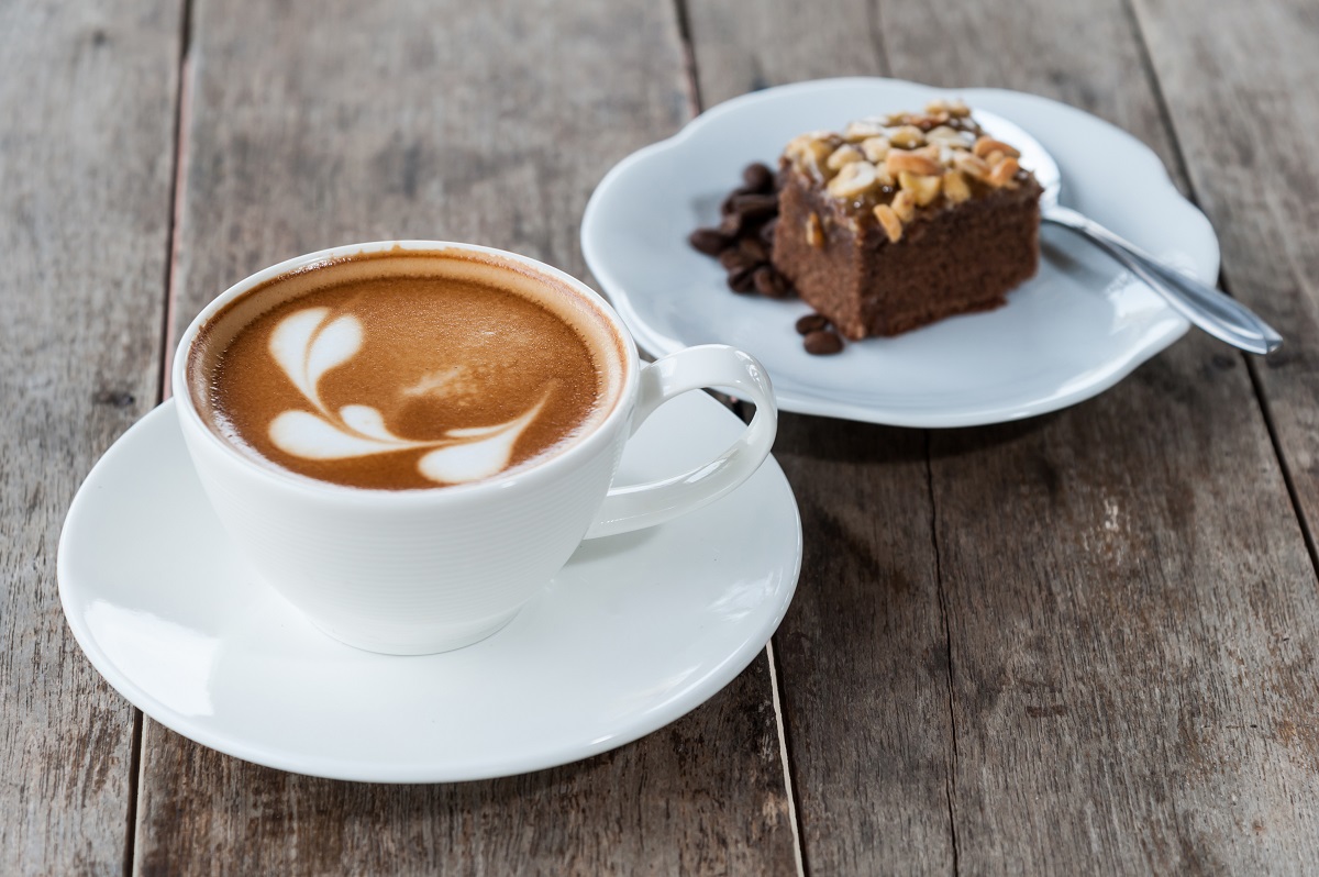 brownie cake and hot coffee on wood table
