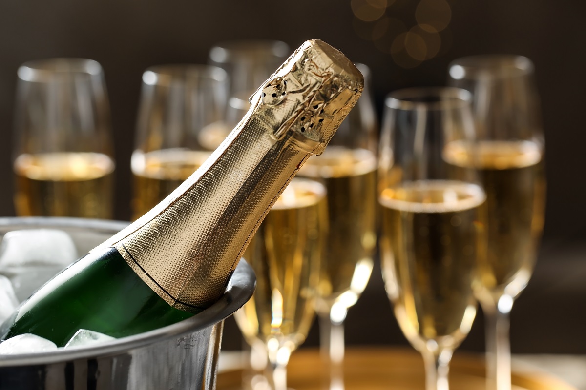 Bottle,Of,Champagne,In,Bucket,With,Ice,And,Glasses,On
