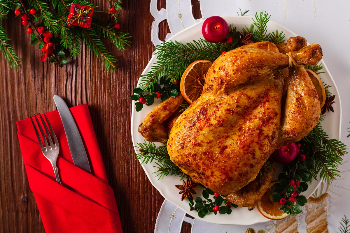 Roasted,Whole,Chicken,With,Christmas,Decoration.,Wooden,Background.,Top,View.