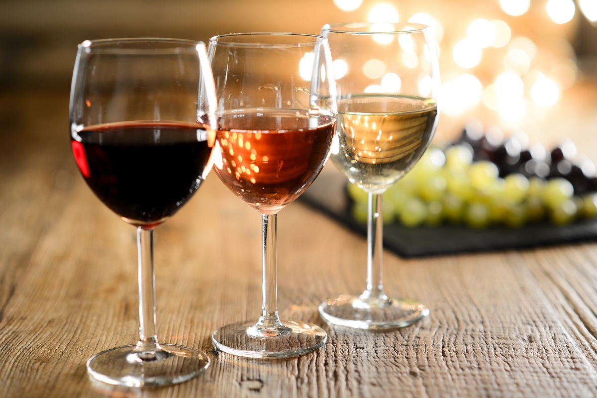 Three,Glass,Of,White,Red,And,Rose,Wine,With,Dim