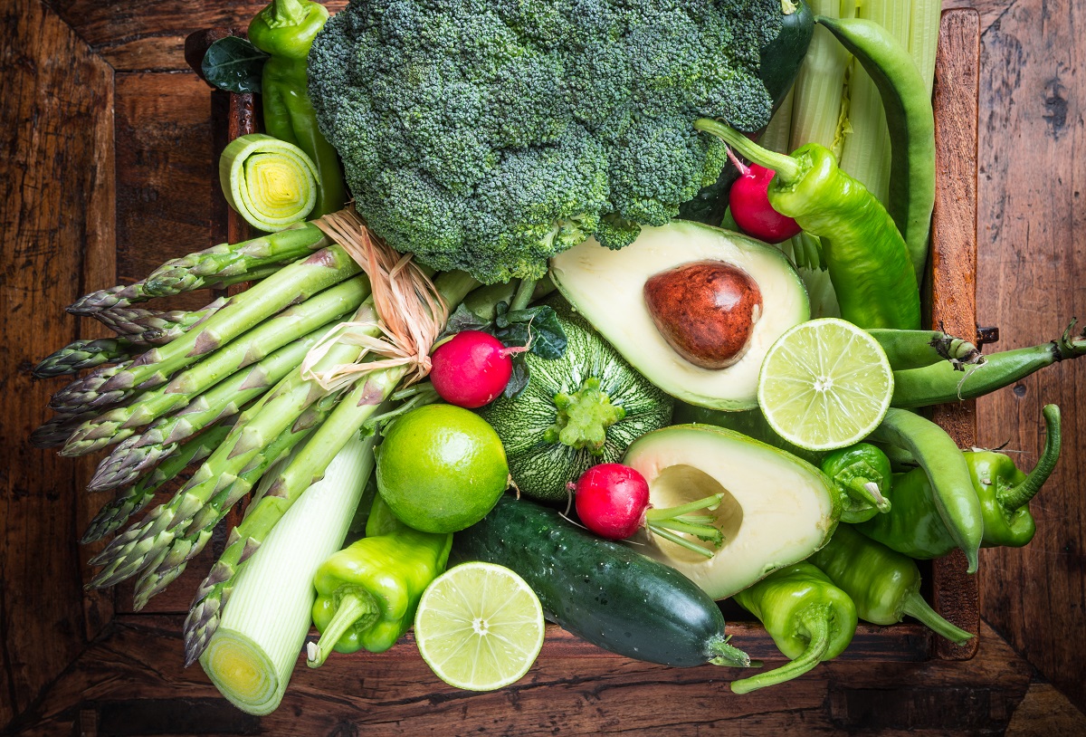 Organic,Green,Vegetables,And,Fruits,On,Dark,Wooden,Background.healthy,Food.
