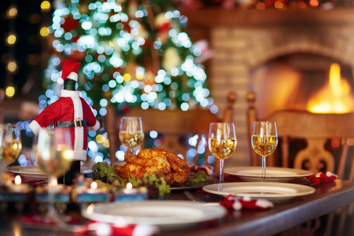 Christmas,Dinner,At,Fireplace,And,Decorated,Xmas,Tree.,Dish,With
