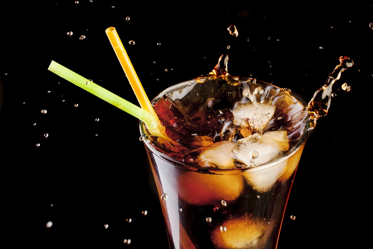 Fresh,Cola,Juice,And,Ice,Cubes,Splash,In,A,Glass