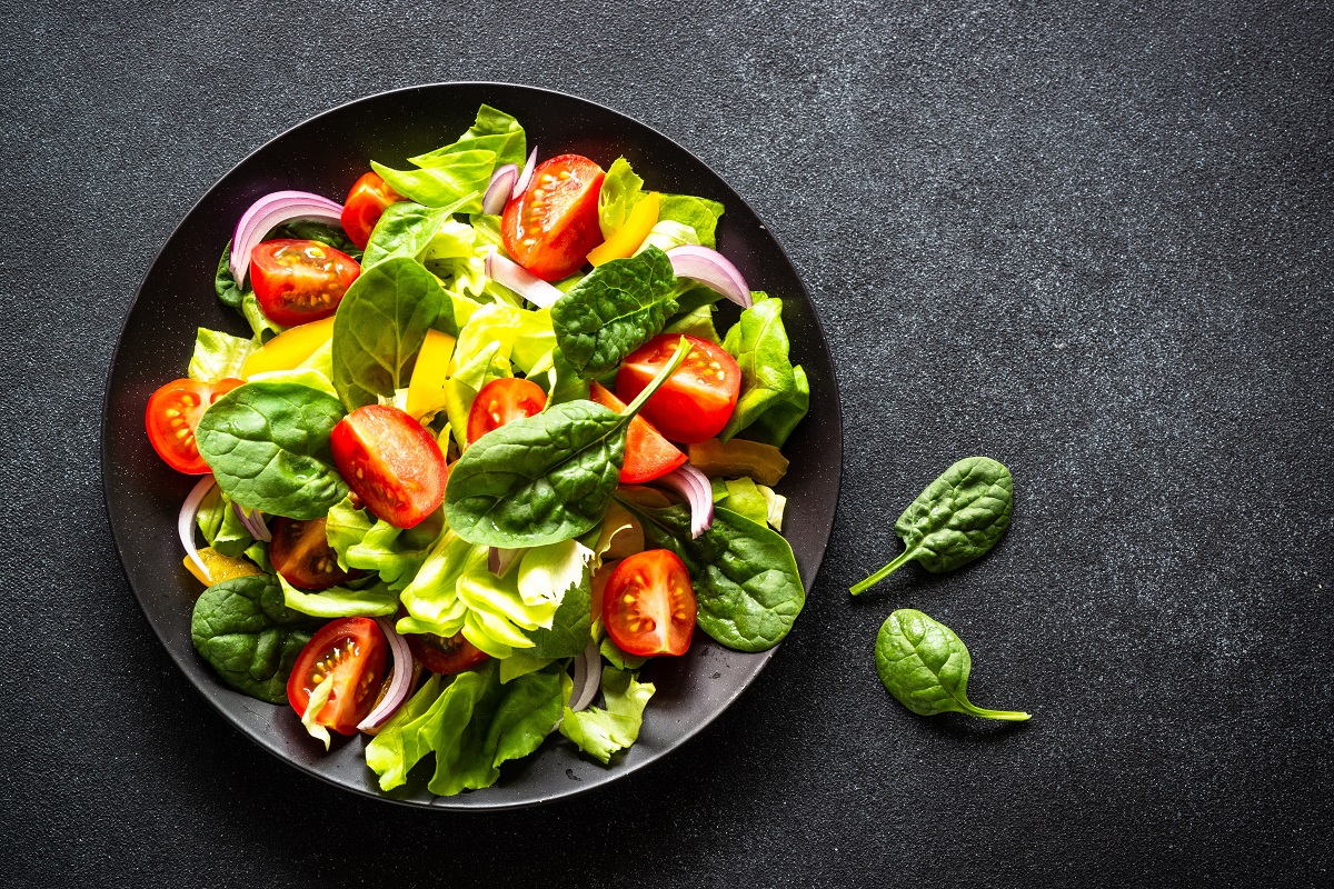 Green,Salad,With,Fresh,Vegetables,And,Green,Leaves,At,Black