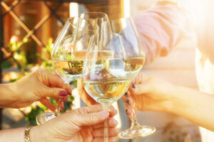 Family,Of,Different,Ages,People,Cheerfully,Celebrate,Outdoors,With,Glasses