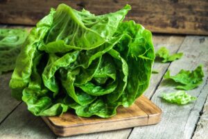 Ripe,Organic,Green,Salad,Romano,On,A,Cutting,Board