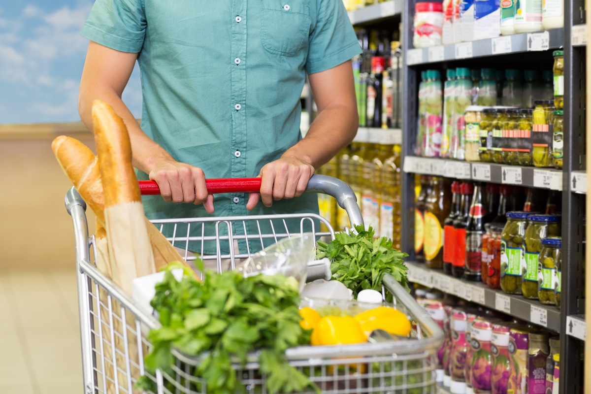 Man,Buy,Products,With,His,Trolley,At,Supermarket