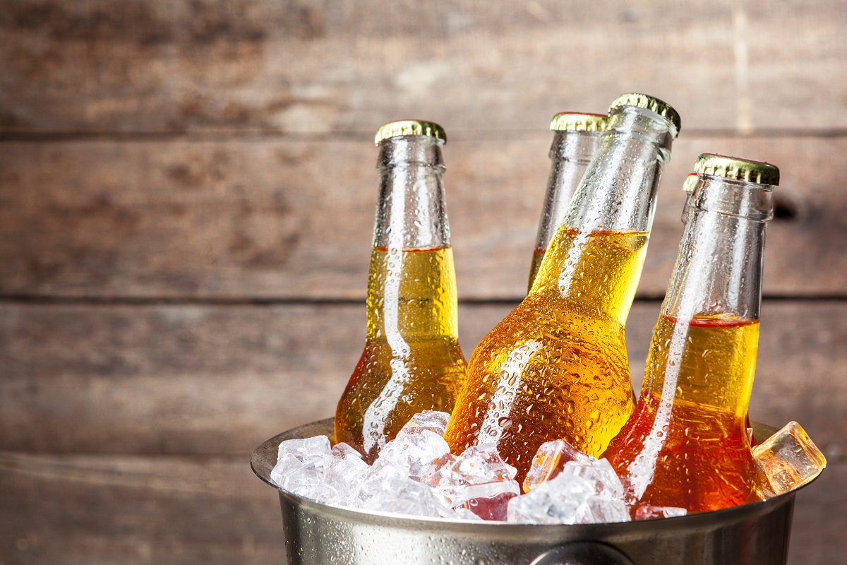 Cold,Bottles,Of,Beer,In,The,Bucket,On,The,Wooden