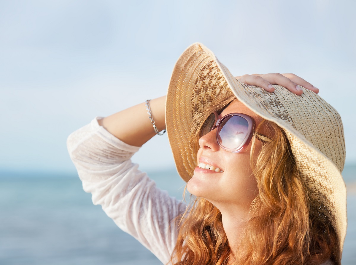 Happy,Woman,Relaxing,At,The,Beach.,Summer,Vacations,Concept