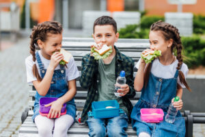 Kids,Eating,Outdoors,The,School,From,Plastick,Lunch,Boxe.,Healthy