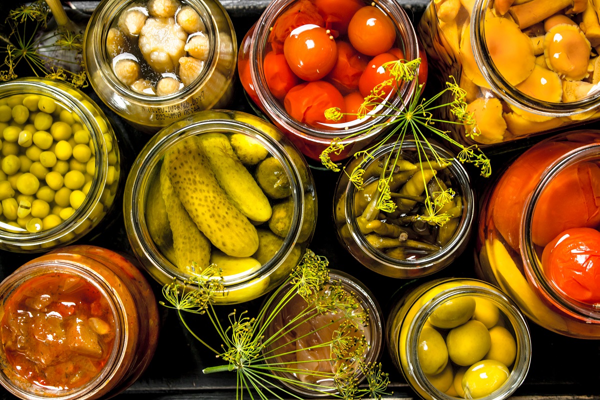 Preserves,Vegetables,In,Glass,Jars,In,An,Old,Box.,On