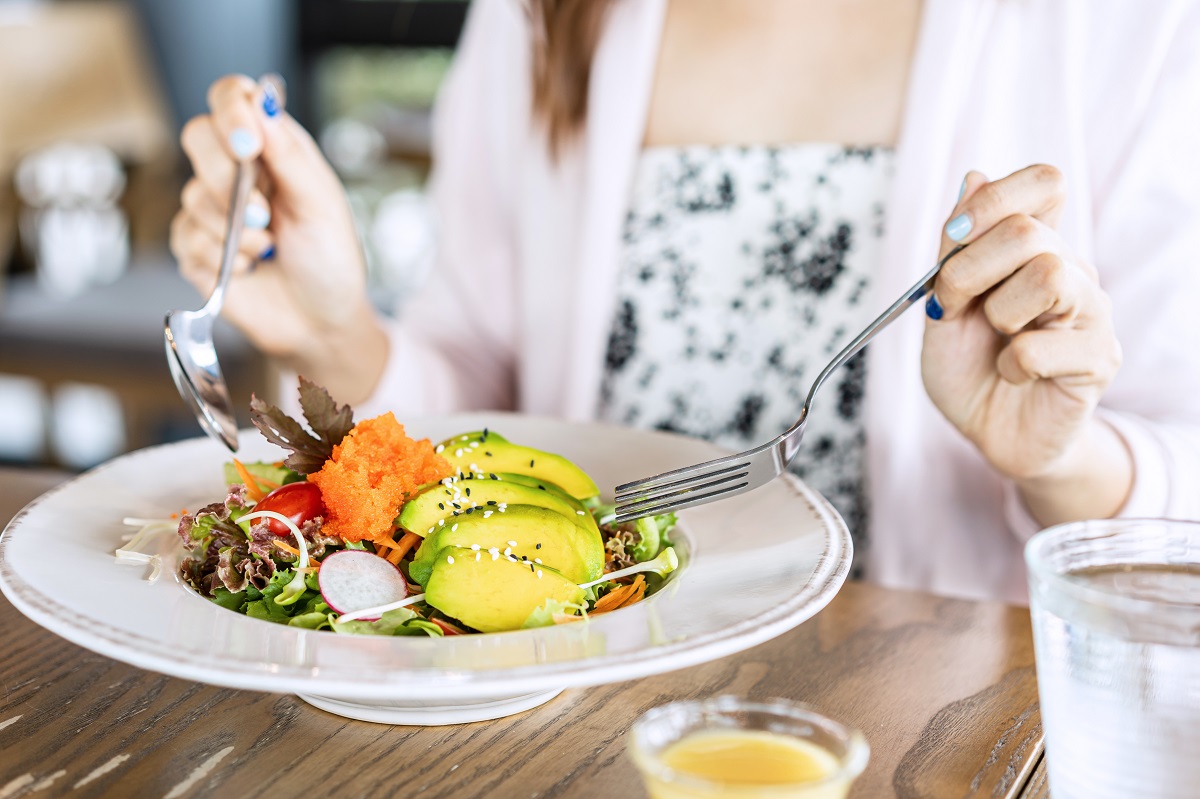 Young,Woman,Eating,Healthy,Salad,At,Restuarant,,Healthy,Lifestyle,,Diet