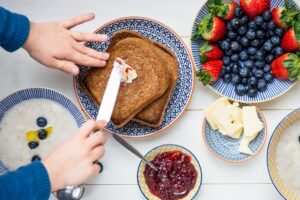 Table,Set,For,Tasty,Family,Breakfast,With,Toasts,,Butter,,Raspberry