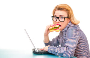 Hungry,Girl,Eating,Sandwich,On,Work,,Isolatd,On,White.,Studio