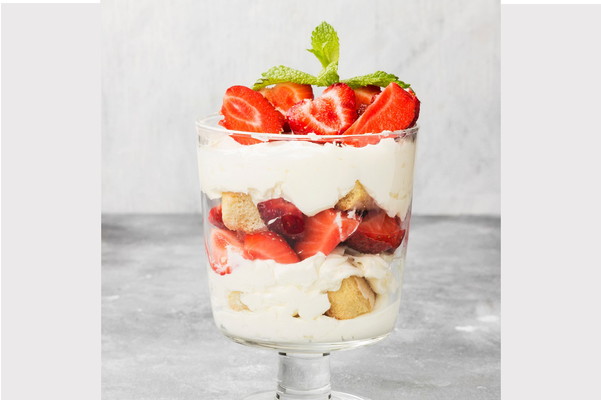 Dessert tiramisu with strawberry on a gray background
