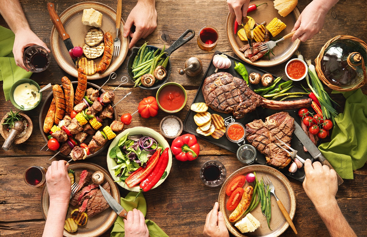 Friends,Having,A,Barbecue,Party.,Group,Of,People,Eating,Grilled