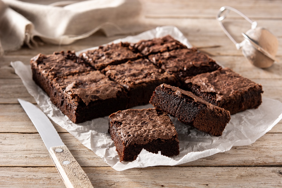 Homemade,Pieces,Of,Brownies,On,Wooden,Table