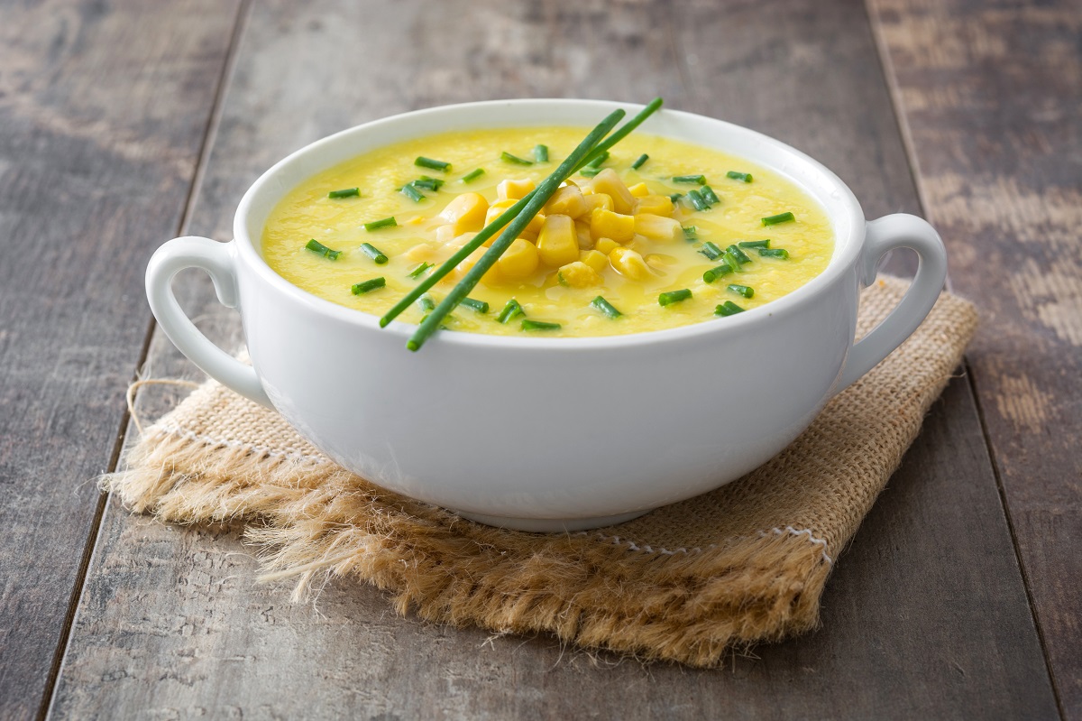Corn,Soup,In,White,Bowl,On,Wooden,Background