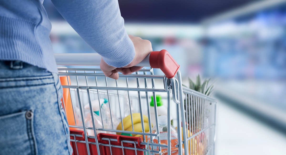 Woman,Doing,Grocery,Shopping,At,The,Supermarket,,She,Is,Pushing