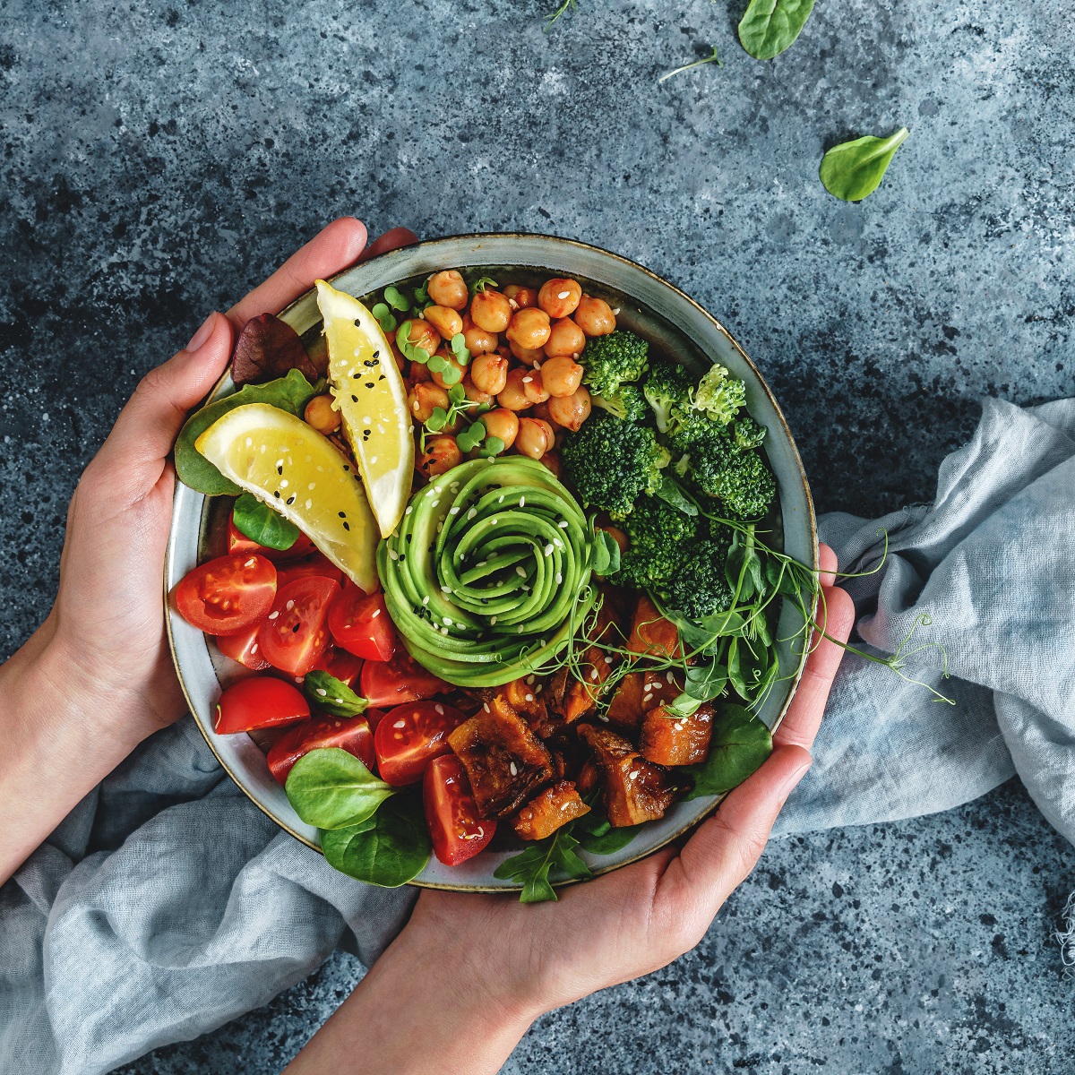 Hands,Holding,Healthy,Superbowl,Or,Buddha,Bowl,With,Salad,,Baked