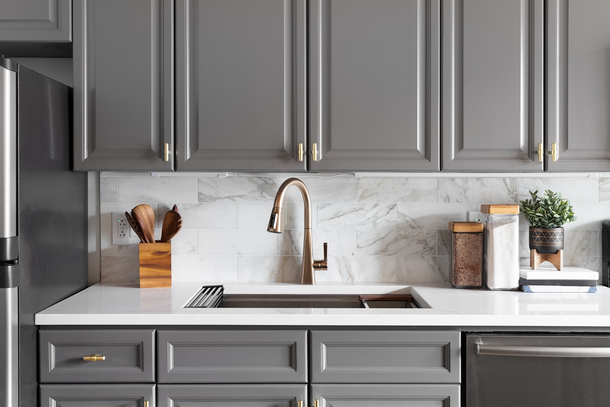 A,Kitchen,Sink,Detail,Shot,With,Grey,Cabinets,,A,White