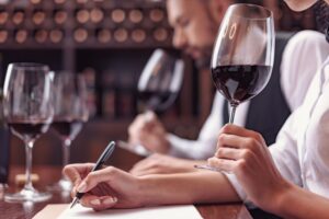 Two,Sommeliers,,Male,And,Female,Tasting,Red,Wine,And,Making