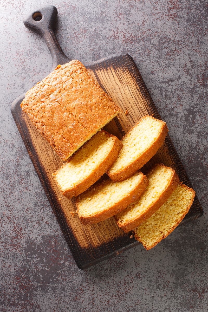 Sliced,Madeira,Cake,Closeup,On,A,Wooden,Cutting,Board,On