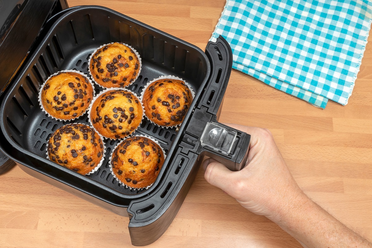 Hand,Baking,Homemade,Muffins,Or,Cupcakes,With,Chocolate,Chips,In